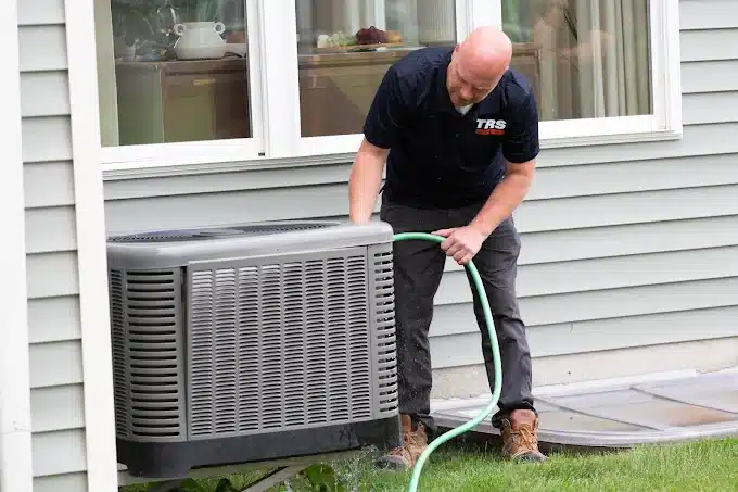Technician performing air conditioner installation at Cheektowaga home<br />
